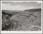 The Deschutes River, like many of the other rivers in the arid portion of central Oregon, is at the bottom of a steep canyon. Stock trails have been built by Resettlement Administration workers to make the water available to cattle