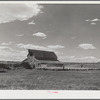 Herders in transit putting their sheep up for the night at a ranch on the Resettlement Administration grazing project in central Oregon