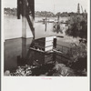 Privy floating in Willamette River. Hooverville, Portland, Oregon