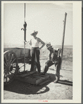 Fixing a dried well on the farm of Mrs. Emma Knoll. Grant County, North Dakota