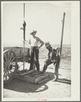 Fixing a dried well on the farm of Mrs. Emma Knoll. Grant County, North Dakota