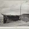 Dugout inhabited by farmers who have abandoned their farms and moved to town. Grassy Butte, North Dakota