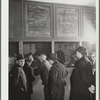 Listing ships in need of sailors. Hiring hall, National Maritime Union. New York City