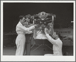 Students working on airplane motor at civilian pilot training school. Meacham Field, Fort Worth, Texas