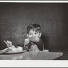 Latin-American child at lunch. Nursery school, FSA (Farm Security Administration) camp. Robstown, Texas