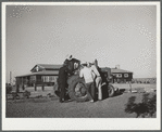 Campers with tractor used in community garden. Robstown FSA (Farm Security Administration) camp, Texas