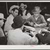 Domino game on Saturday night. Community center. Robstown camp, Texas