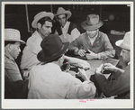 Domino game on Saturday night. Community center. Robstown camp, Texas