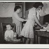 Family preparing tortillas for evening meal. Robstown camp, Texas