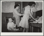 Family preparing tortillas for evening meal. Robstown camp, Texas