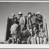 Migratory workers returning from day's work. Robstown camp, Texas