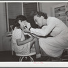 Nurse Doris Dill with young patient. Robstown, Texas