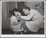 Nurse Doris Dill with young patient. Robstown, Texas