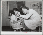 Nurse Doris Dill with young patient. Robstown, Texas