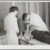 Doctor examining patient. Robstown FSA (Farm Security Administration) camp, Texas
