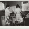 Family preparing tortillas for supper. Robstown camp, Texas