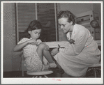 Robstown, Texas. FSA (Farm Security Administration) migratory workers camp. Young patient treating injury under supervision of a nurse