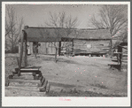 Dog-run log cabin in which Joe Handley, tenant farmer, lives. Walker County, Alabama