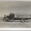 Farmers with load of sugar beets waiting at sugar beet dump. Adams County, Colorado