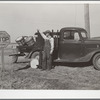 Farmer selling produce on highway. Marshall County, Iowa