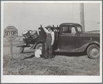 Farmer selling produce on highway. Marshall County, Iowa