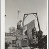 Unloading corn into elevator for storage in crib. Grundy County, Iowa