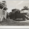 Farmer buys sugar beet tops for feed. Brighton, Colorado