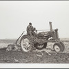 Fred Wilfang, rehabilitation client, uses modern tractor bought with FSA (Farm Security Administration) loan. Black Hawk County, Iowa
