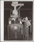 Farm boy at pop stand. General store. Lamoille, Iowa