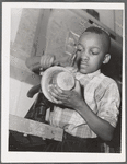 Harlem Community Art Center: student in metal craft class, 290 Lenox Avenue