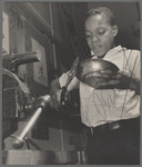 Harlem Community Art Center: student in metal craft class, 290 Lenox Avenue