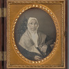 Portrait of an elderly woman sitting in gothic-style chair