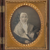 Portrait of an older woman sitting in gothic-style chair