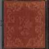 Portrait of a young woman with book in lap