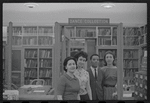 Staff members Genevieve Oswald, Miriam Gross, Leroy Fentress, and Jacqueline Maskey in the Dance Collection of the New York Public Library
