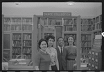 Staff members Genevieve Oswald, Miriam Gross, Leroy Fentress, and Jacqueline Maskey in the Dance Collection of the New York Public Library