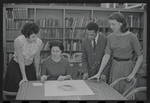 Staff members Miriam Gross, Genevieve Oswald, Leroy Fentress, and Jacqueline Maskey in the Dance Collection of the New York Public Library