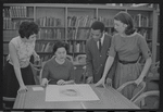 Staff members Miriam Gross, Genevieve Oswald, Leroy Fentress, and Jacqueline Maskey in the Dance Collection of the New York Public Library