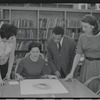 Staff members Miriam Gross, Genevieve Oswald, Leroy Fentress, and Jacqueline Maskey in the Dance Collection of the New York Public Library