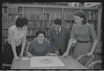 Staff members Miriam Gross, Genevieve Oswald, Leroy Fentress, and Jacqueline Maskey in the Dance Collection of the New York Public Library