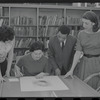 Staff members Miriam Gross, Genevieve Oswald, Leroy Fentress, and Jacqueline Maskey in the Dance Collection of the New York Public Library