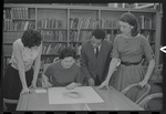 Staff members Miriam Gross, Genevieve Oswald, Leroy Fentress, and Jacqueline Maskey in the Dance Collection of the New York Public Library