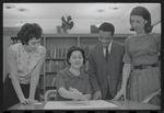 Staff members Miriam Gross, Genevieve Oswald, Leroy Fentress, and Jacqueline Maskey in the Dance Collection of the New York Public Library