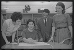 Staff members Miriam Gross, Genevieve Oswald, Leroy Fentress, and Jacqueline Maskey in the Dance Collection of the New York Public Library