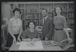 Staff members Miriam Gross, Genevieve Oswald, Leroy Fentress, and Jacqueline Maskey in the Dance Collection of the New York Public Library