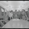Staff members Miriam Gross, Genevieve Oswald, Leroy Fentress, and Jacqueline Maskey in the Dance Collection of the New York Public Library