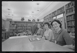 Staff members Leroy Fentress, Jacqueline Maskey, Miriam Gross, and Genevieve Oswald in the Dance Collection of the New York Public Library