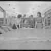 Staff members Miriam Gross, Genevieve Oswald, Leroy Fentress, and Jacqueline Maskey in the Dance Collection of the New York Public Library