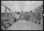 Staff members Miriam Gross, Genevieve Oswald, Leroy Fentress, and Jacqueline Maskey in the Dance Collection of the New York Public Library