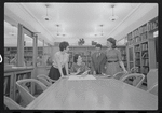Staff members Miriam Gross, Genevieve Oswald, Leroy Fentress, and Jacqueline Maskey in the Dance Collection of the New York Public Library